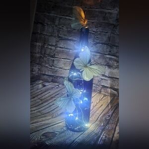 Cobalt blue wine bottle electric LED lights with white butterflies centerpiece